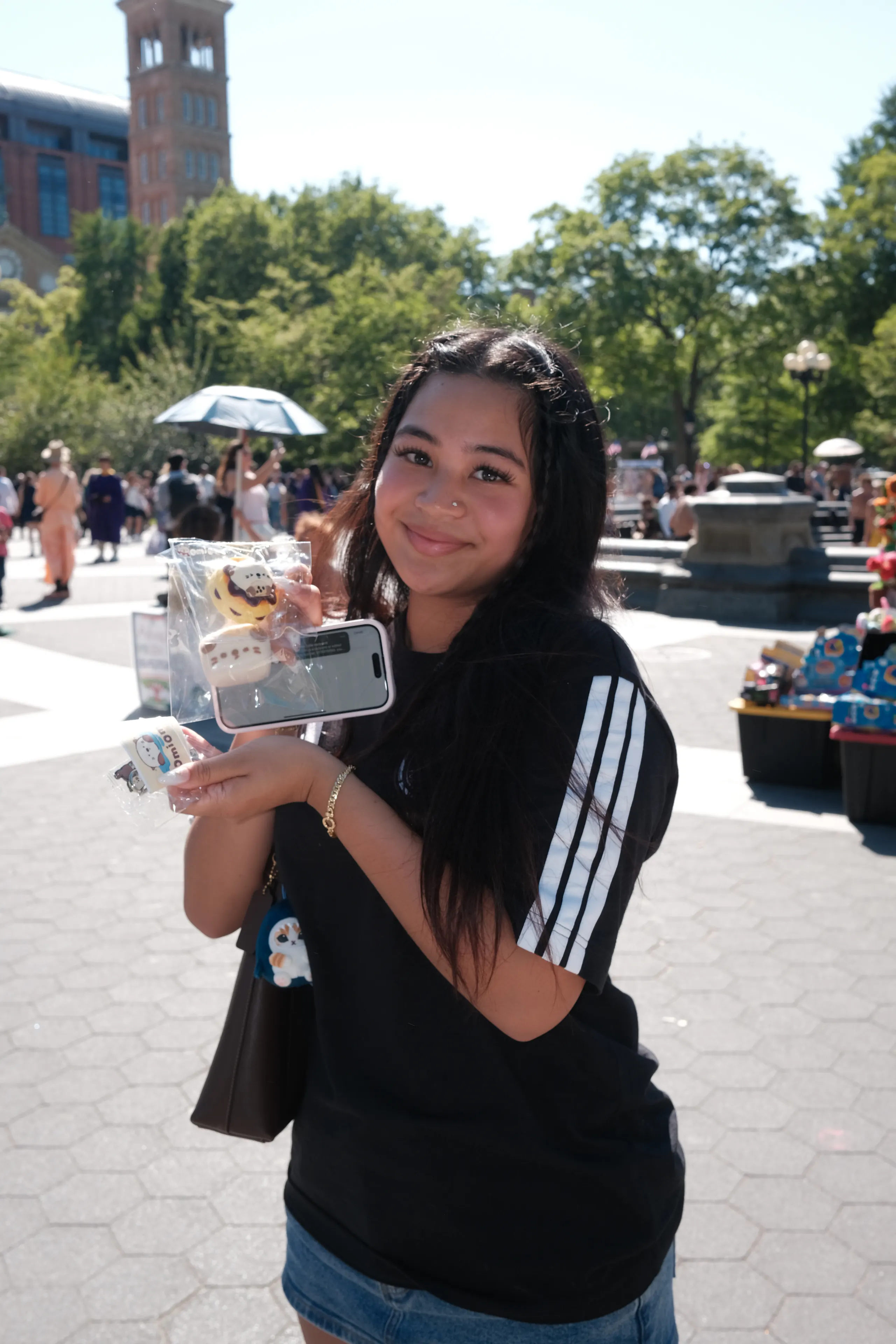 A visitor holding an OMIOMI object