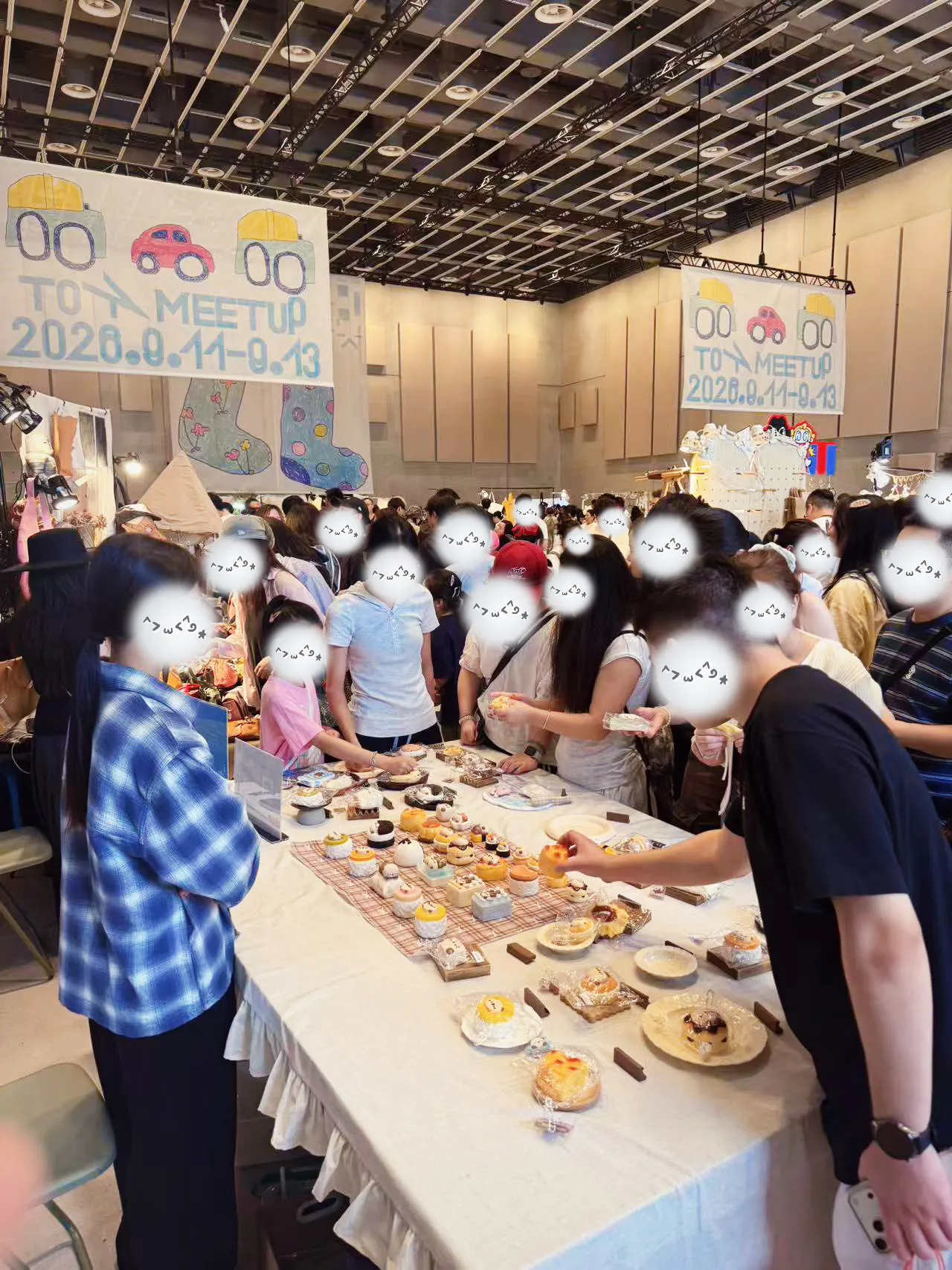 Visitors gathered around an OMIOMI table