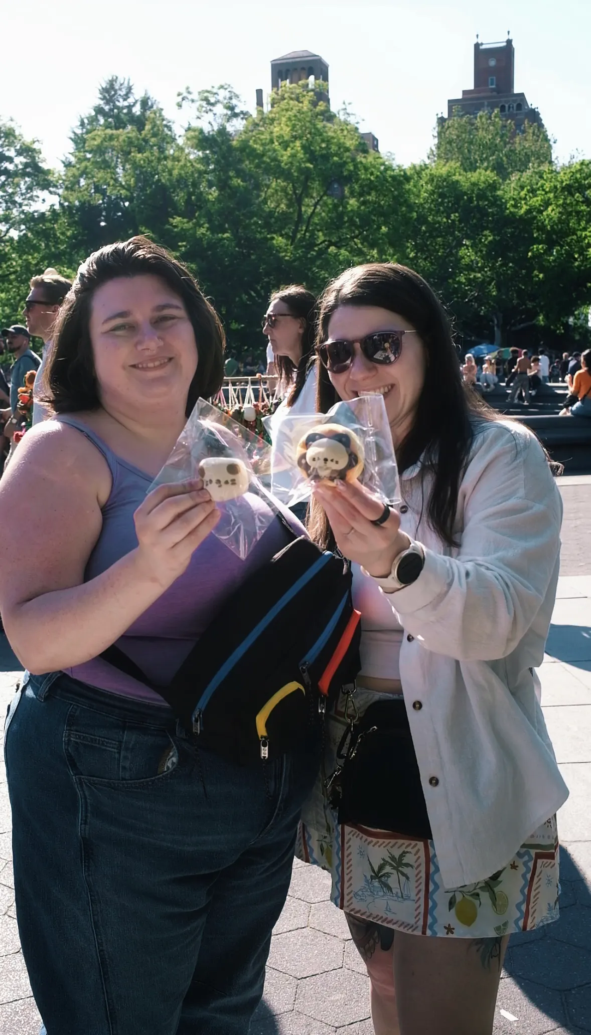 Two visitors holding OMIOMI objects