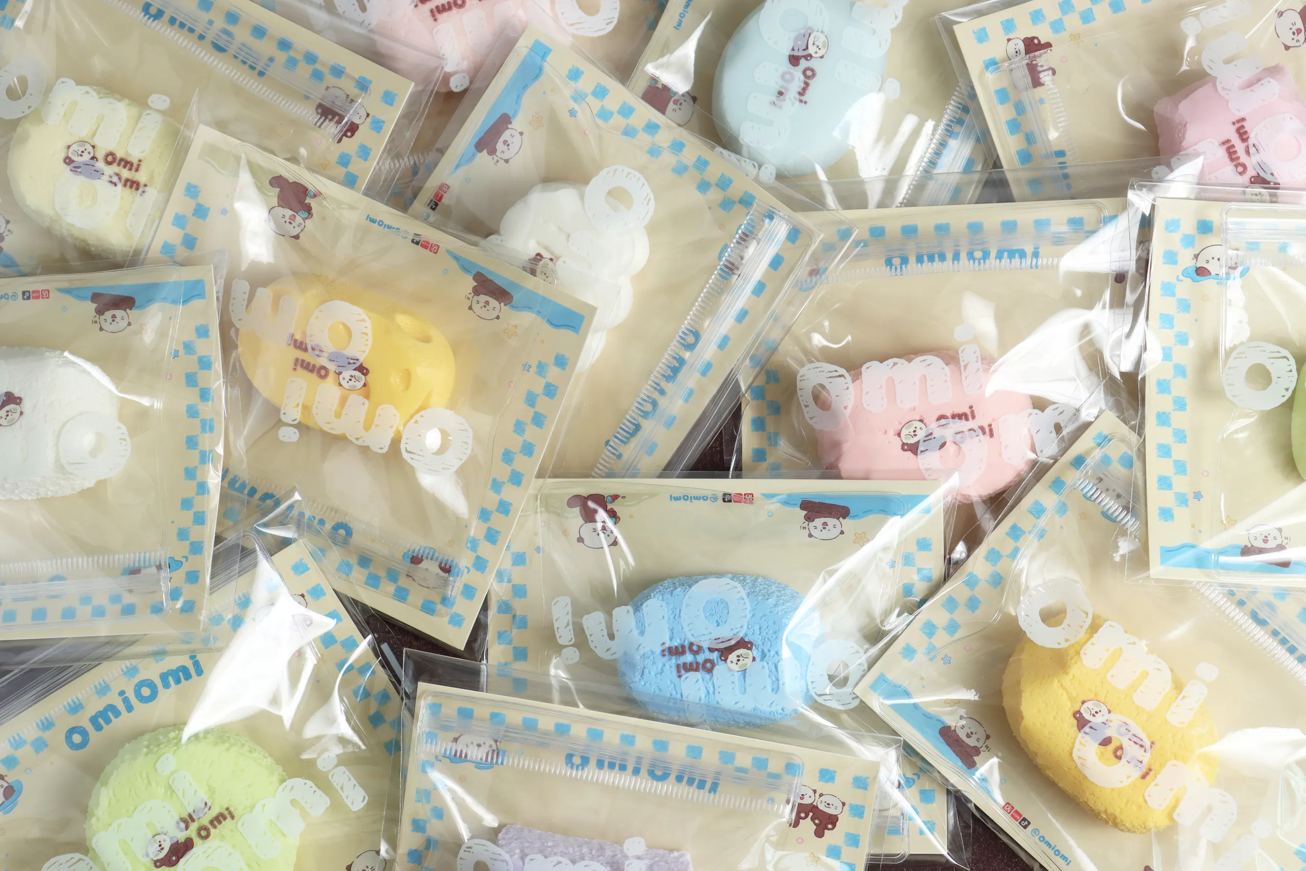 Soft-coloured OMIOMI pieces arranged together